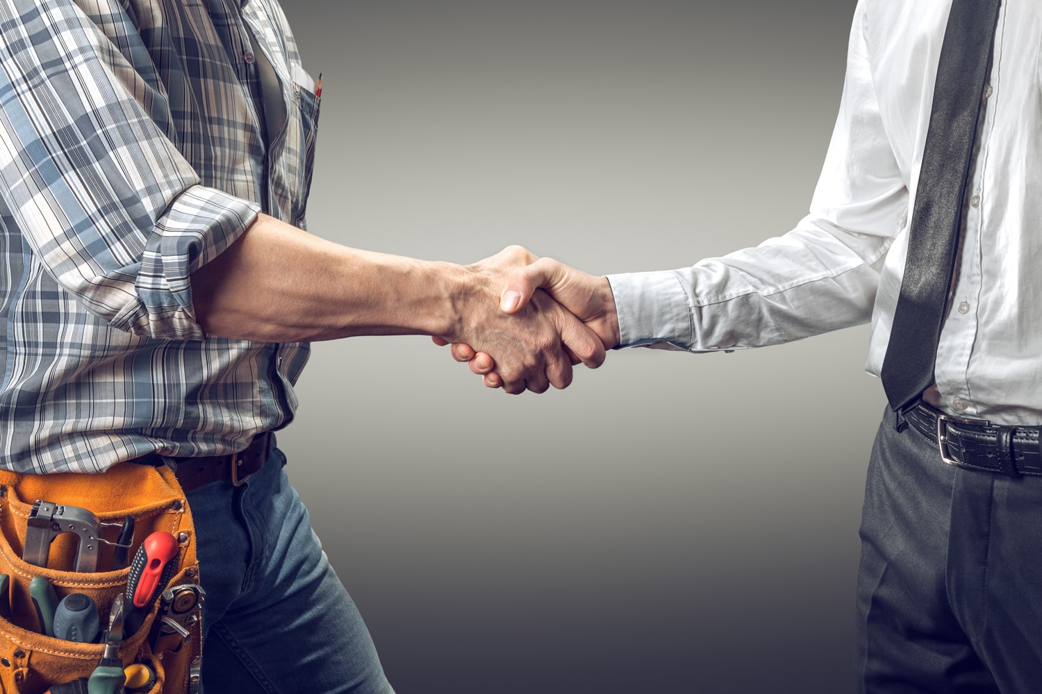 contractor shaking a cabinet broker's hand